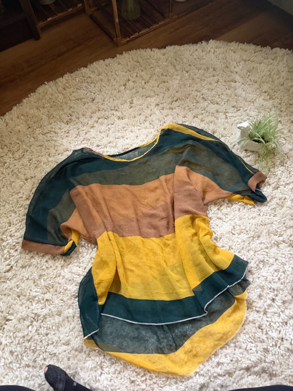 Sheer colorblock tunic featuring bold yellow, deep green, and warm brown flowy s